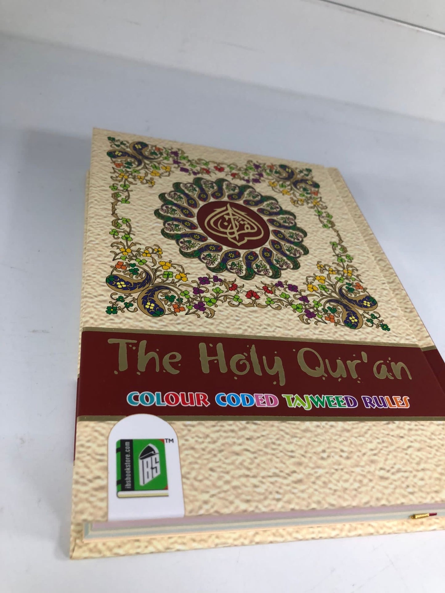 Hold Quran with Tajweed rules